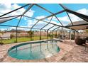 Relaxing screened-in pool and patio area at 12107 Gulfstream Blvd, Port Charlotte, FL 33981