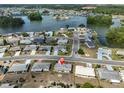 Aerial view of a single-story home in a lakeside community with beautiful views at 1529 Allegheny Dr, Sun City Center, FL 33573