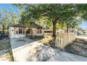 Front yard view of a charming house with a picket fence at 3109 E Ida St, Tampa, FL 33610