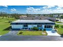 Single story home with a large yard and golf course views at 332 Club Manor Dr # 10, Sun City Center, FL 33573