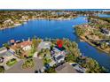 Aerial view of waterfront home showcasing its location and unique architectural style at 3391 Maple Ne St, St Petersburg, FL 33704