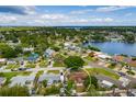 Stunning aerial view of the property showcasing its waterfront location and lush surroundings and established neighborhood at 8950 3Rd N St, St Petersburg, FL 33702