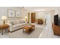 Cozy living room featuring neutral colors, a dining table, and tile flooring at 11200 102Nd Ave # 136, Seminole, FL 33778