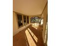 Sunroom with new flooring and many windows at 5508 N Branch Ave, Tampa, FL 33604