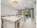 Modern kitchen with stainless steel appliances and an island at 8607 Canyon Creek Trl, Parrish, FL 34219