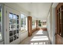 Enclosed front porch with tiled floor and brick wall at 1045 17Th N Ave, St Petersburg, FL 33704