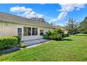 Backyard with patio and lush landscaping at 2403 Nantucket Green Ct # 0, Sun City Center, FL 33573