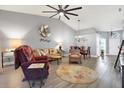 Open living room with vaulted ceiling and neutral decor at 2403 Nantucket Green Ct # 0, Sun City Center, FL 33573