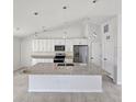 Modern kitchen with island and stainless steel appliances at 2452 Nantucket Ter, North Port, FL 34286
