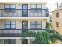View of building showing multiple balconies and entrances at 315 30Th W Ave # B201, Bradenton, FL 34205