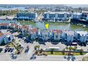 Stunning aerial view of waterfront townhomes with private docks and lush landscaping near the intercoastal at 179 Medallion Blvd # C, Madeira Beach, FL 33708