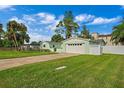 Light green house with a two-car garage and a well-maintained lawn at 3887 50Th S Ave, St Petersburg, FL 33711