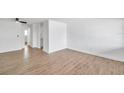 Bright living room featuring wood-look tile floors and ceiling fan at 2353 Shelley St # 16, Clearwater, FL 33765