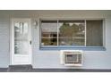 White door and window, brick building exterior, ac unit at 2353 Shelley St # 4, Clearwater, FL 33765