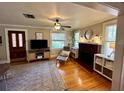 Living room with hardwood floors, fireplace and access to the front door at 1435 29Th N Ave, St Petersburg, FL 33704