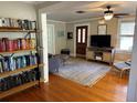 Living room with hardwood floors, a fireplace and built-in shelving at 1435 29Th N Ave, St Petersburg, FL 33704