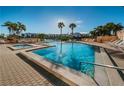 Inviting pool area with hot tub and lounge chairs at 7625 Sun Island S Dr # 103, South Pasadena, FL 33707