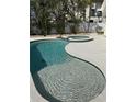 Beautiful backyard pool and jacuzzi area with a spacious patio at 239 Punta Vista Dr, St Pete Beach, FL 33706