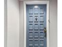 Gray apartment door with brass hardware at 6372 Palma Del Mar S Blvd # 605, St Petersburg, FL 33715