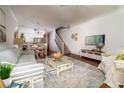 Bright and airy living room with hardwood floors and coastal decor at 4630 Mirabella Ct, St Pete Beach, FL 33706