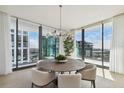 Modern dining room with city views at 1000 Water St # 1702, Tampa, FL 33602