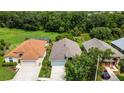 Aerial view showcases the home's location with well-maintained lawns and backyard green space at 27542 Sky Lake Circle, Wesley Chapel, FL 33544