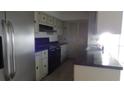 View of kitchen with stainless steel appliances and cabinetry at 3706 Joe Sanchez Rd, Plant City, FL 33565
