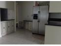 Kitchen features stainless steel appliances and dark countertops at 3706 Joe Sanchez Rd, Plant City, FL 33565