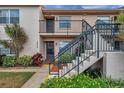 Inviting condominium with well-maintained landscaping and welcoming staircase at 3840 Staysail Ln # 3840, Holiday, FL 34691