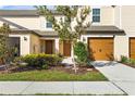 Tan two-story home with landscaping and garage at 5315 Companion Ln, Tampa, FL 33619