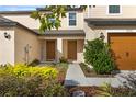 Front view of two-story home with landscaping at 5315 Companion Ln, Tampa, FL 33619
