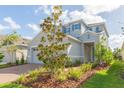 Two-story house with gray siding and blue shutters at 5625 Del Coronado Dr, Apollo Beach, FL 33572