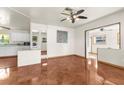 Bright living room with tile floors and a kitchen view at 7695 17Th N Way, St Petersburg, FL 33702