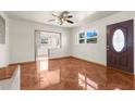 Bright living room featuring tile floors and a view into the kitchen at 7695 17Th N Way, St Petersburg, FL 33702
