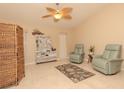 Relaxing sunroom with wicker furniture and ceiling fan at 8900 143Rd St, Seminole, FL 33776