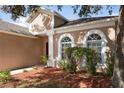 One-story home with a two-car garage and well-maintained lawn at 9423 Black Thorn Loop, Land O Lakes, FL 34638