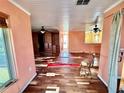 Living room with hardwood floors and built-in shelving at 3020 Clinton S St, Gulfport, FL 33707
