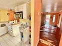 Kitchen with white cabinets and an older microwave at 3020 Clinton S St, Gulfport, FL 33707