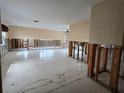 Spacious living room with exposed framing, ready for renovation at 6496 Fairway View S Blvd, St Petersburg, FL 33707