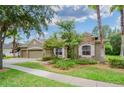 House exterior showcasing a two-car garage and landscaping at 10645 Plantation Bay Dr, Tampa, FL 33647