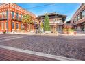 Brick-paved street with shops and a Christmas tree at 2224 E 10Th Ave, Tampa, FL 33605