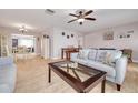 Bright and airy living room with light tile flooring and comfy sofas at 3522 98Th N Ave, Pinellas Park, FL 33782