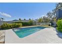 Inviting rectangular pool with surrounding patio at 5181 Horseshoe Ne Pl, St Petersburg, FL 33703
