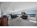 Bright living room with hardwood floors and water views at 6363 Gulf Winds Dr # 437, St Pete Beach, FL 33706