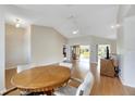 Bright dining area with a round table and access to other rooms at 719 Winterbrooke Way, Sun City Center, FL 33573