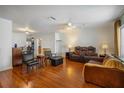 Spacious living room with wood floors, comfortable seating, and ample natural light at 1321 Bluewater Dr, Sun City Center, FL 33573