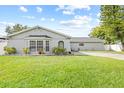 Newly renovated home with well-manicured lawn at 7343 Brookview Cir, Tampa, FL 33634