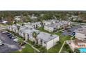 Aerial view of an apartment complex with a pool and ample parking at 7701 Starkey Rd # 324, Seminole, FL 33777