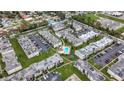 Aerial view of an apartment complex with a pool and ample parking at 7701 Starkey Rd # 324, Seminole, FL 33777