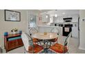 Bright kitchen features white shaker cabinets and a breakfast bar at 122 E Saint Johns Way, Apollo Beach, FL 33572
